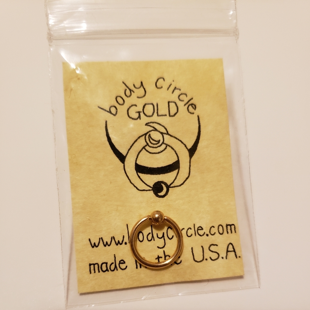 14k gold captive bead ring by Body Circle